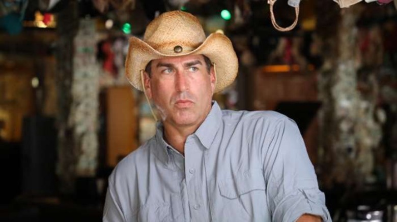 Rob Riggle wearing straw hat