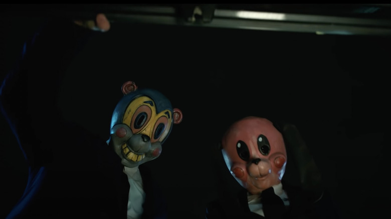 Hazel and Cha-Cha wearing masks in "The Umbrella Academy"