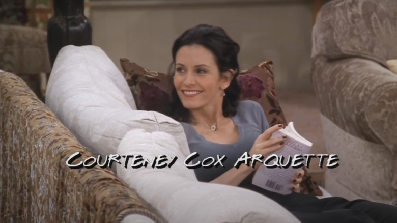 Courteney Cox reading