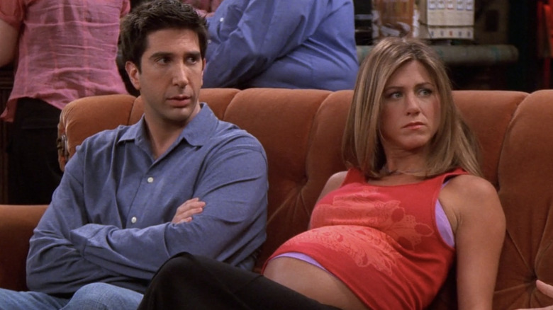 Pregnant Rachel sits with Ross