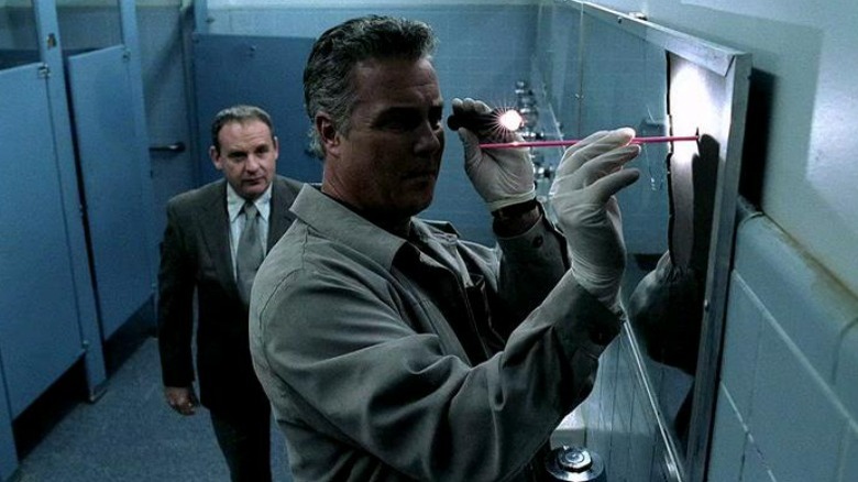 Gil Grissom inspecting a crime scene