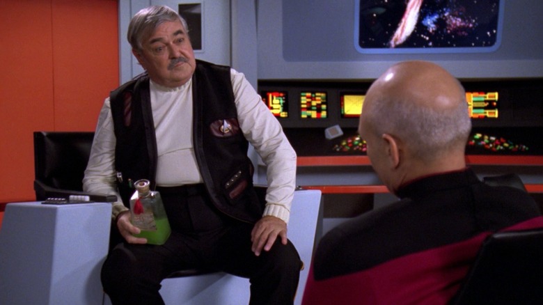 Scotty and Picard share a drink