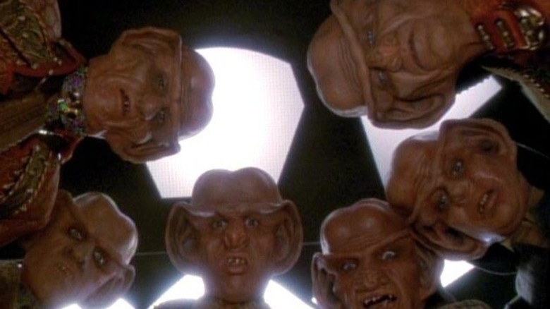 Six concerned Ferengi look down