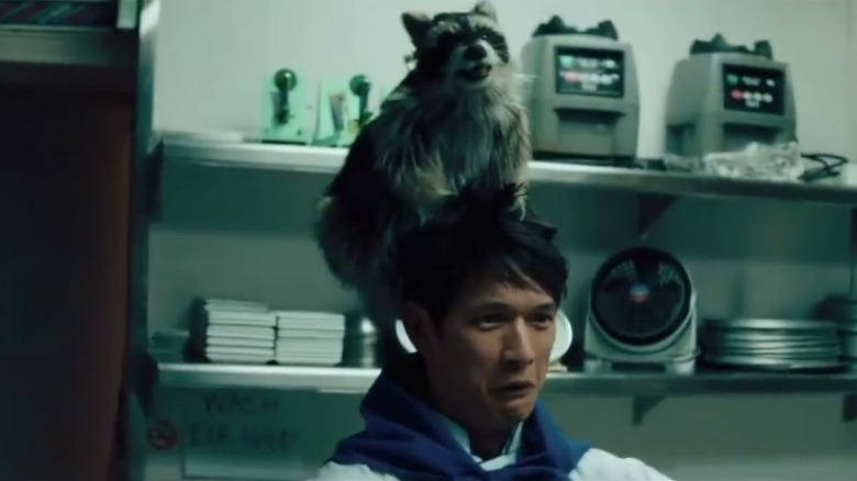 A chef being controlled by a raccoon in Everything Everywhere All at Once