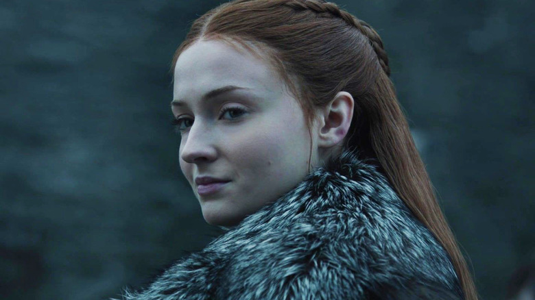 Sansa Stark smirks over shoulder