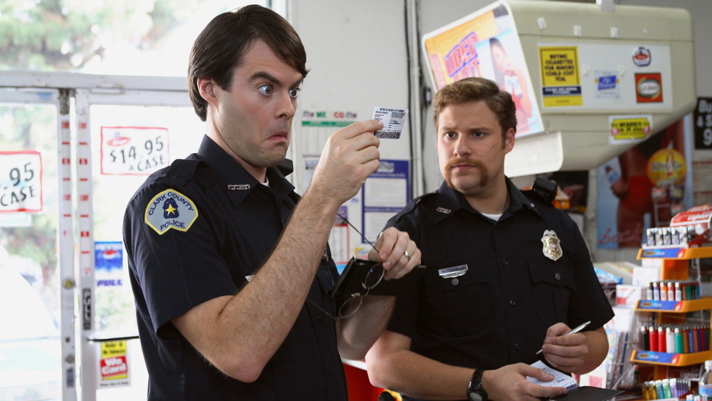 Bill Hader looks at a driver's license