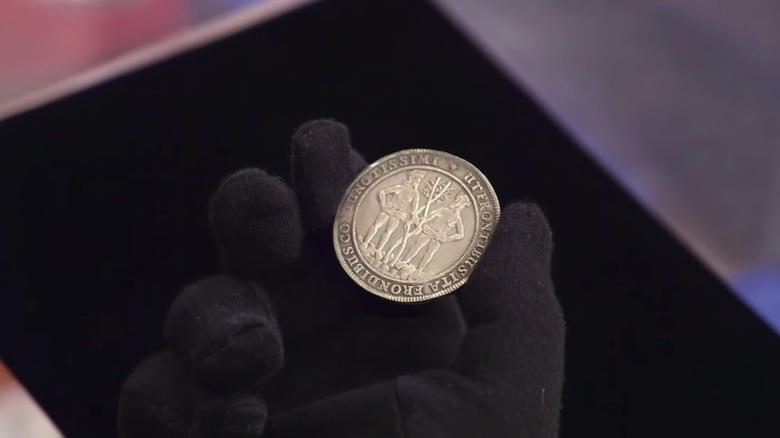 Rick Harrison holds Wildman coin on Pawn Stars