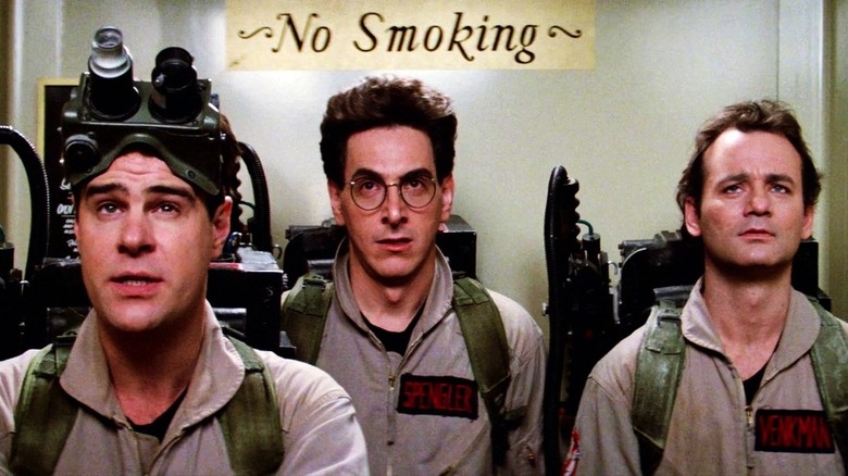 Ray, Egon, and Venkman stare at a ghost