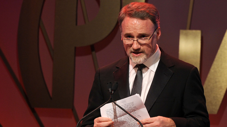 Fincher reading speech on stage