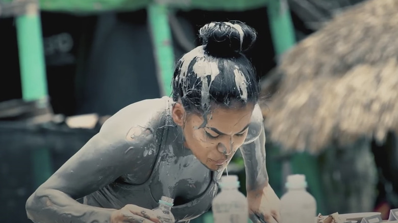 Girl covered in mud