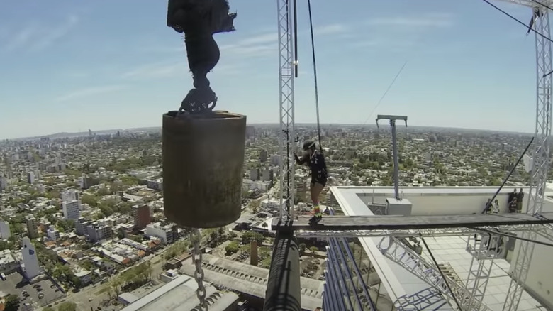 Girl on the edge of a crane 