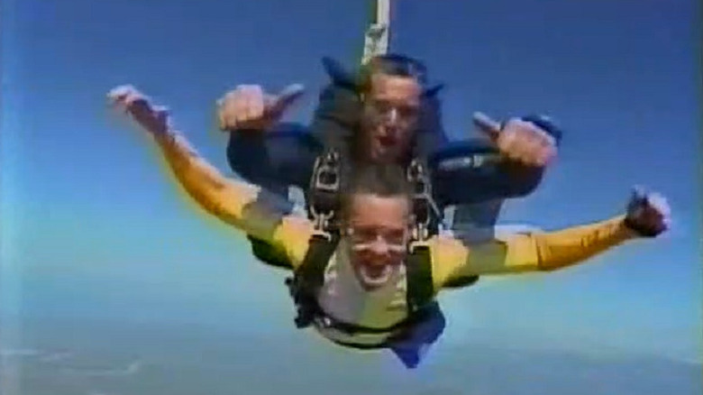 Contestants jumping out of a plane