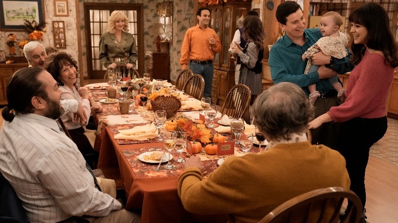 The Goldbergs all sitting happily around the Thanksgiving table