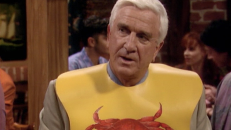 Leslie Nielsen wearing lobster bib