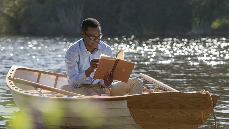 Chidi in a rowboat