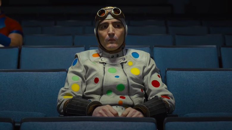 Polka-Dot Man sitting in theater