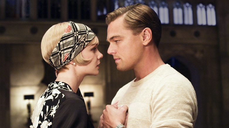 Daisy and Gatsby in embrace