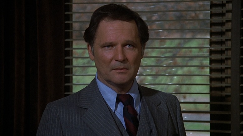 Dean Wormer scowls in his office