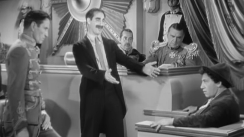 The Marx Brothers gesturing in court