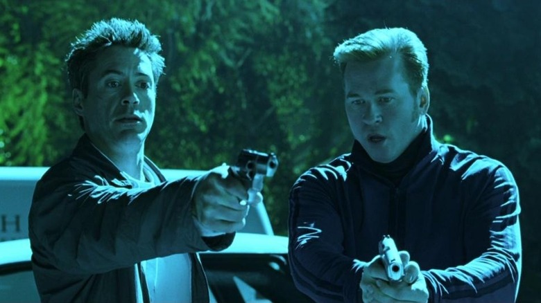 Lockhart and Perry holding guns