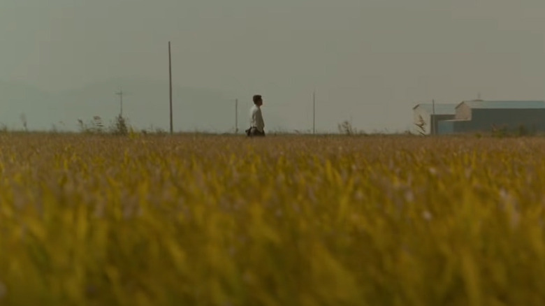 Detective Park Doo-man walking in field