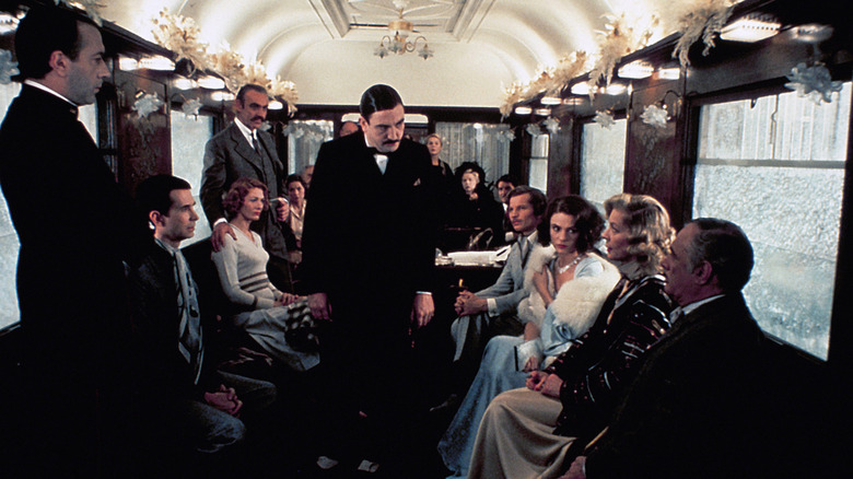 Poirot talking to train passengers