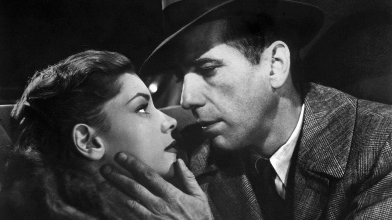 Philip Marlowe and Vivian embrace