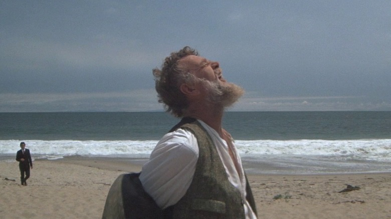 Roger Wade yelling on beach