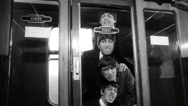 The Beatles aboard a train