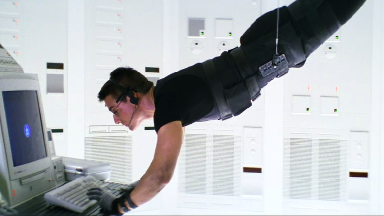 Ethan Hunt hanging from a wire