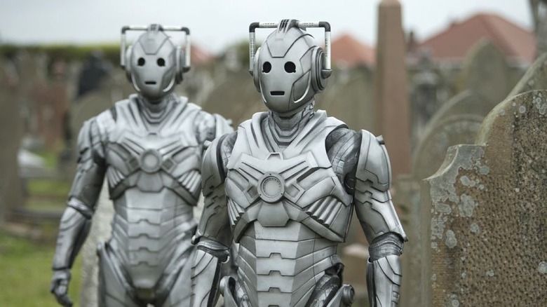 Cybermen walking through graveyard