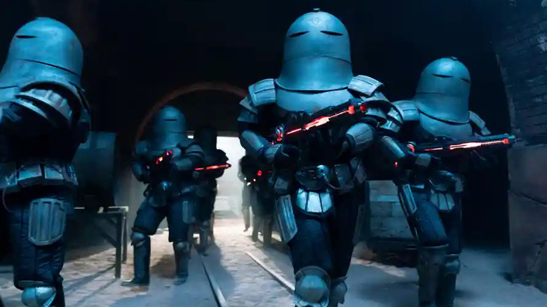 Armored Sontaran squad holding rifles