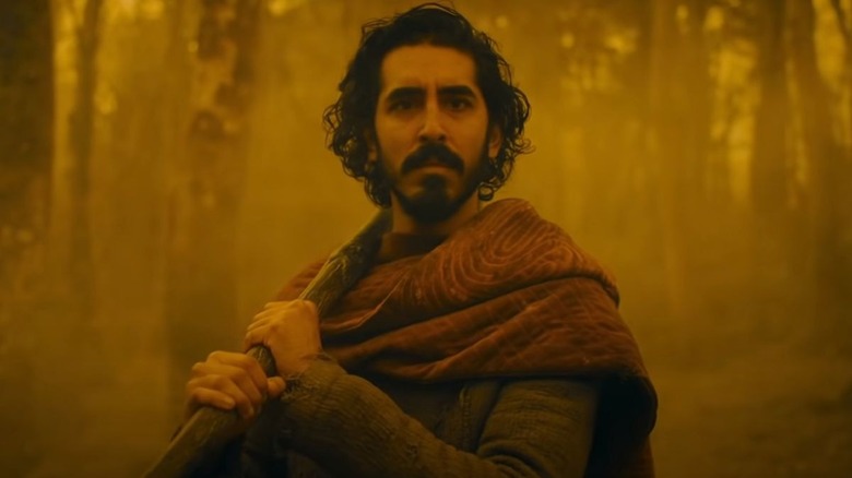 Dev Patel Sir Gawain holding stick