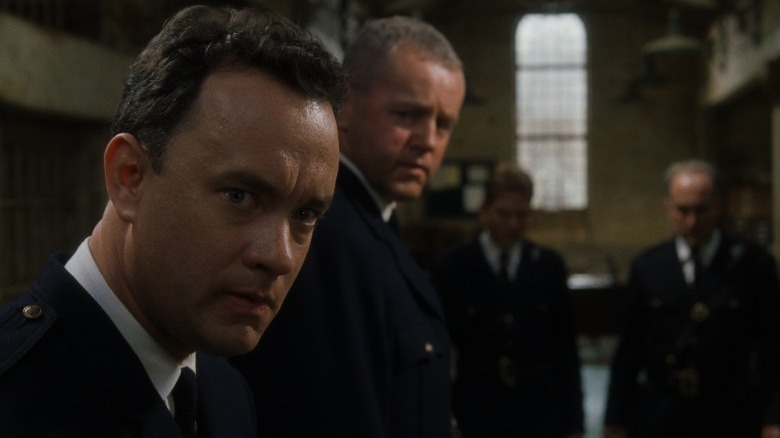 Tom Hanks in a prison guard's uniform 