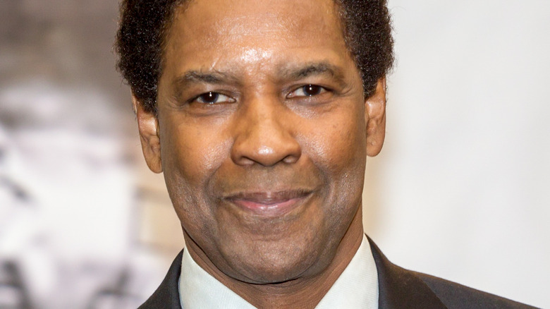 Denzel Washington smirks