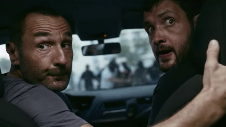 Gilles Lellouche, Karim Leklou driving in car The Stronghold