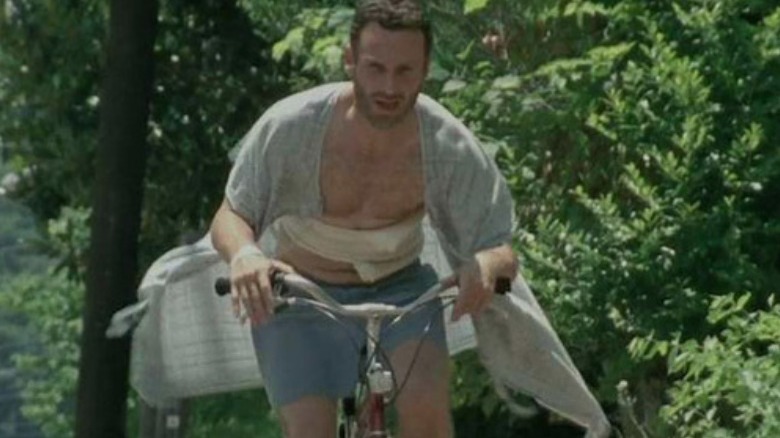 Rick Grimes riding a bike