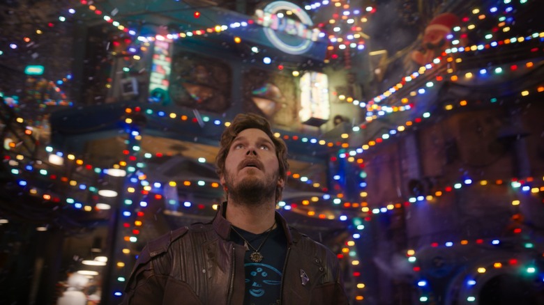 Starlord looks up at Christmas lights