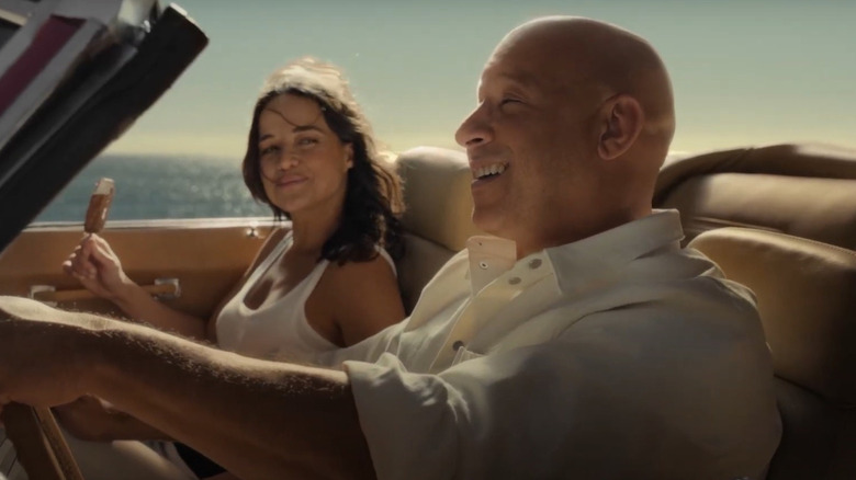 Michelle Rodriguez eats ice cream while Vin Diesel drives