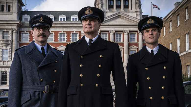 Charles Cholmondeley, Ewen Montagu and Ian Fleming looking