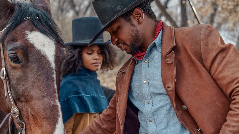 Zazie Beetz and Jonathan Majors in The Harder They Fall