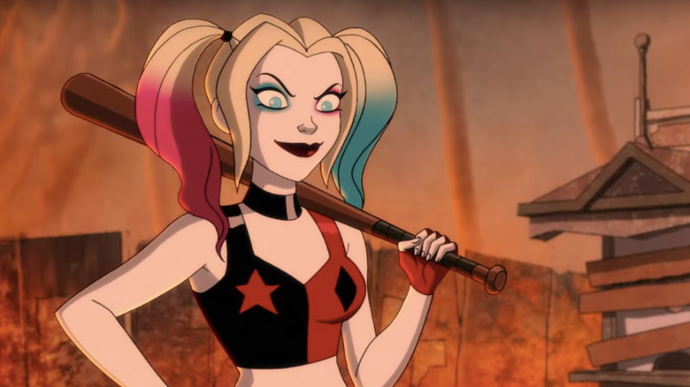 Harley smirking while holding bat 