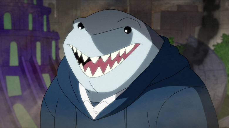 King Shark smiling in blue sweatshirt 