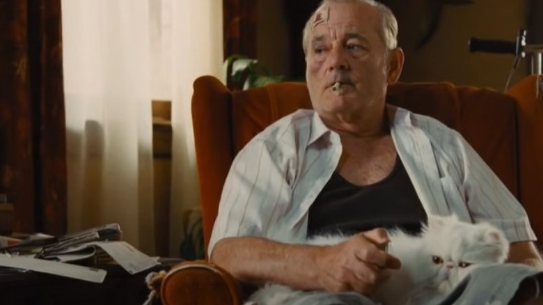 Bill Murray holding cat smoking