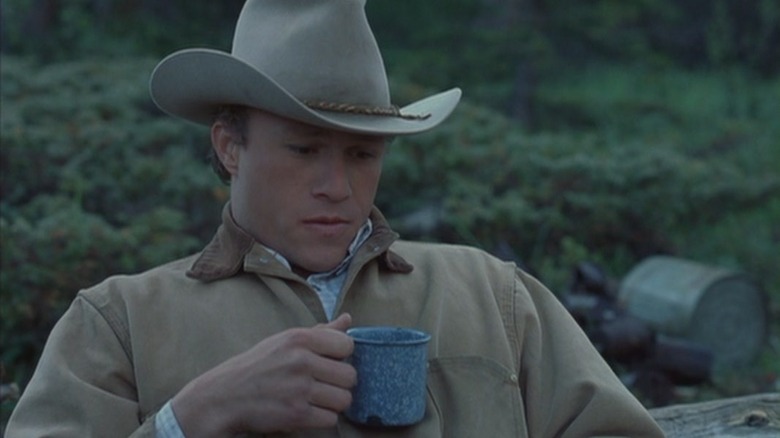 Ledger drinking coffee with cowboy hat