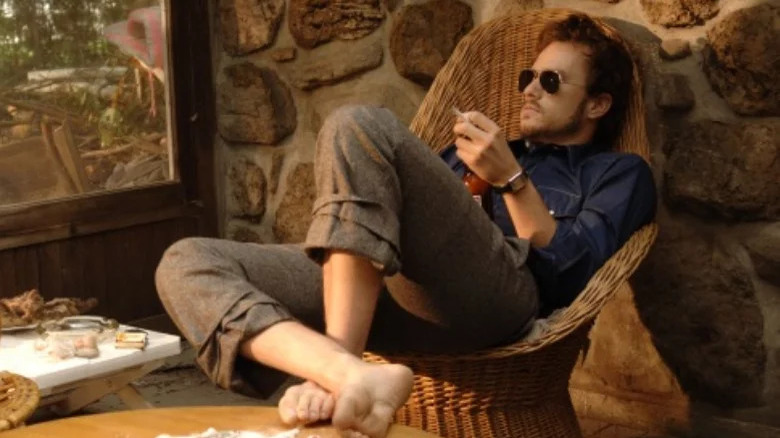 Ledger sitting with sunglasses on