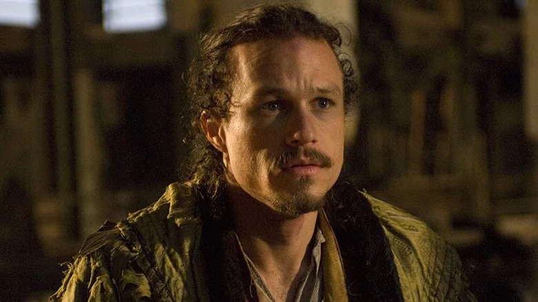 Ledger with curly hair and mustache