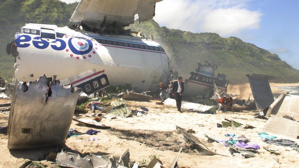 Matthew Fox as Jack Shepard wanders through wreckage on Lost