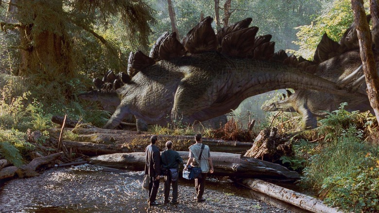 Dinosaurs walk past the human leads of The Lost World: Jurassic Park