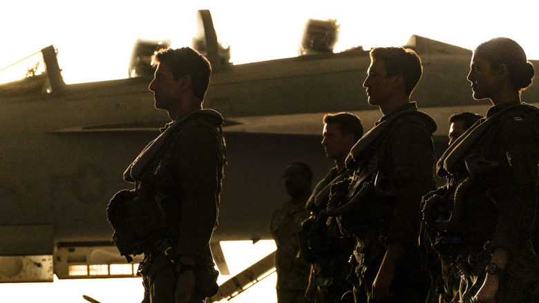 Top Gun pilots in front of plane